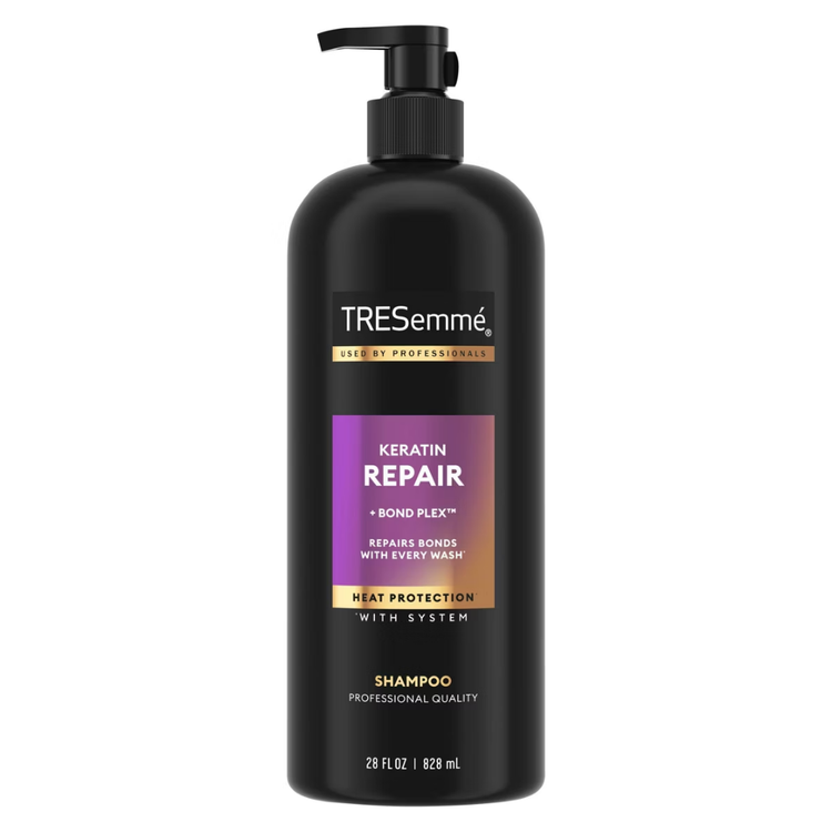 TRESemmé Keratin Repair Shampoo Bond Plex 28oz bottle, with related hair care products in the background