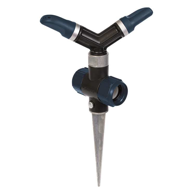 Gilmour Poly Whirling Sprinkler with metal spike for watering lawns and gardens, adjustable spray pattern, durable plastic construction.