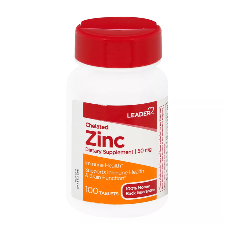 Leader Chelated Zinc supplement bottle with 100 tablets, showing the label and zinc tablets inside.