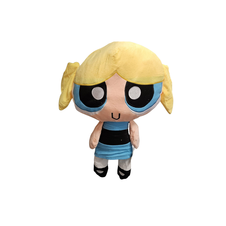 Soft plush toy of Bubbles from The Powerpuff Girls by Farmacias Savia, featuring her signature blue dress and cheerful expression.