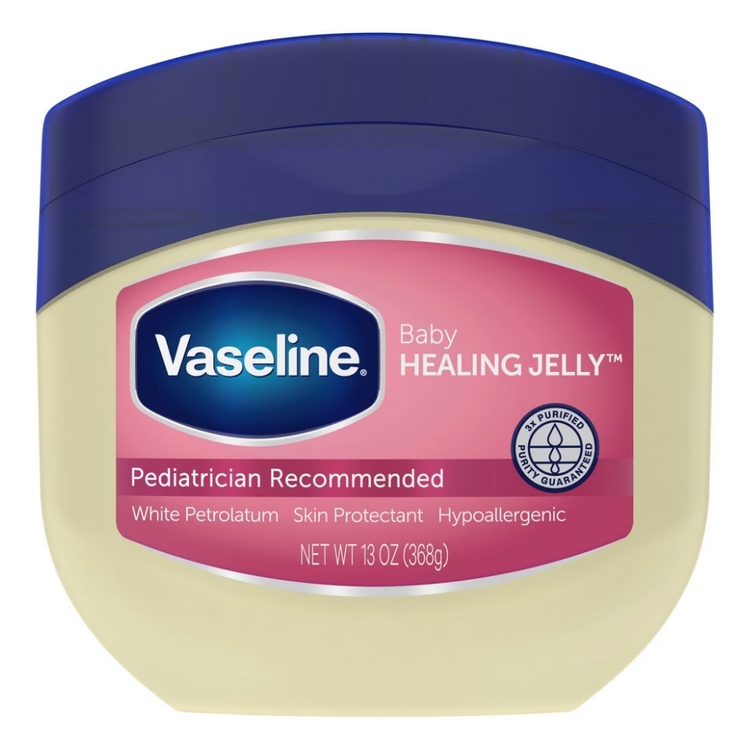 Vaseline 100% pure petroleum jelly in a 13oz container, suitable for baby skin, displayed in a healthcare setting