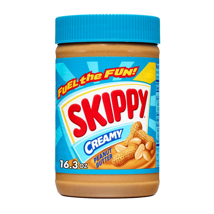 Creamy Skippy peanut butter jar from La Comprita, 16oz, with the label featuring peanuts and the Skippy logo.