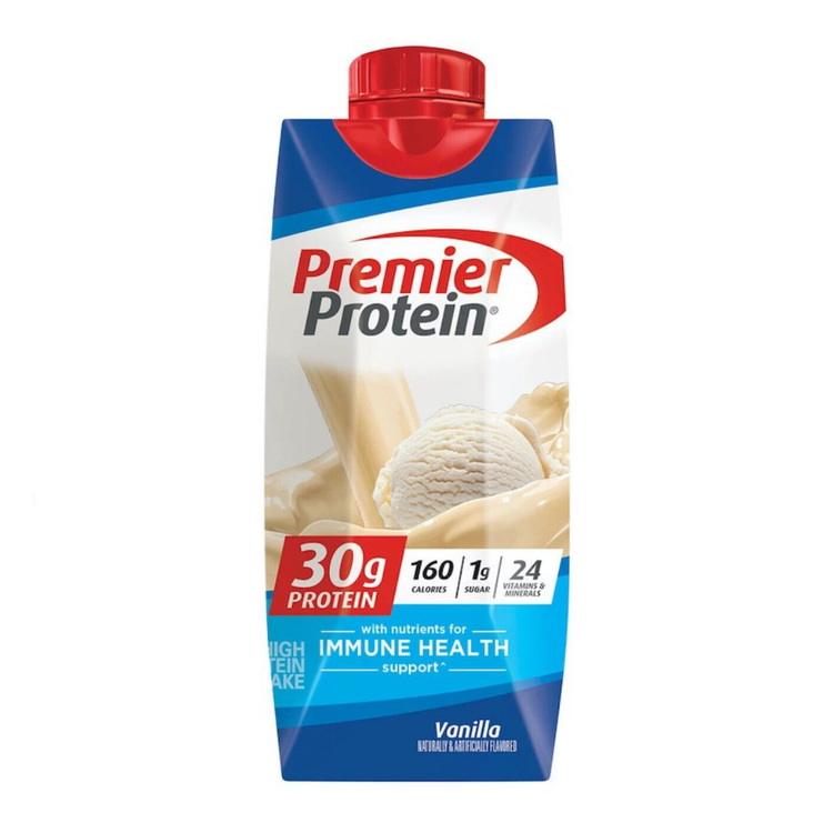 Vanilla Premier Protein Shake in an 11oz bottle from Farmacias Savia, displayed on a candy shop-themed background.