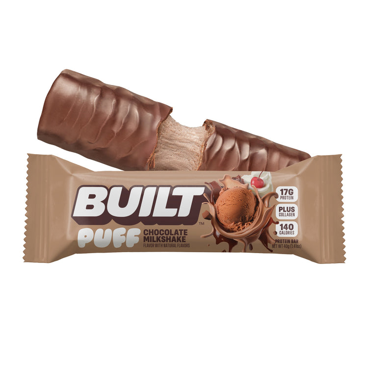 Built Chocolate Milkshake Puff stacked with creamy milkshake filling and chocolate coating, displayed on a white background.