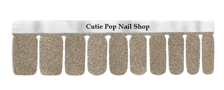 Shimmering gold glitter nail strips from Cutie Pop Nail Shop, showcasing a dazzling, sparkly design perfect for stylish manicures.