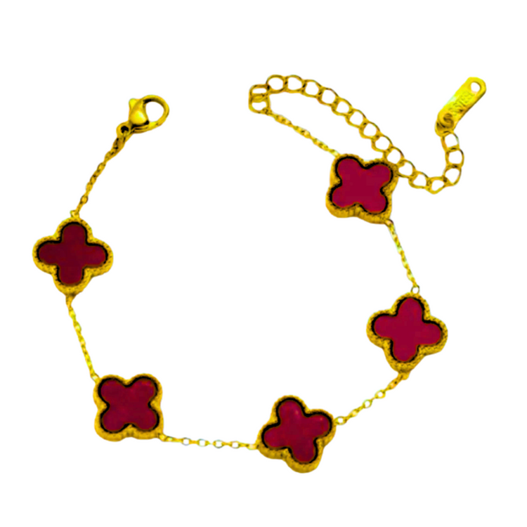 Red Clara Clover Charm Bracelet from Farmacias Savia featuring a vibrant clover design in jewelry style.