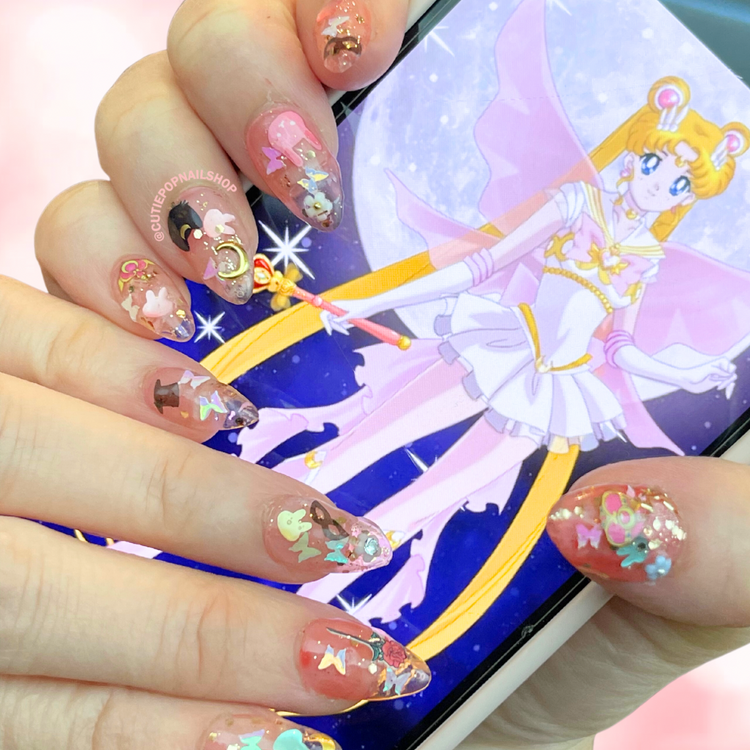 Cutie Pop Nail Shop Luna nail polish bottle with purple label and cap, displayed on a white background.