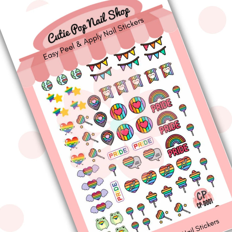 Rainbow Pride nail art design by Cutie Pop Nail Shop featuring vibrant rainbow colors on neatly manicured nails.