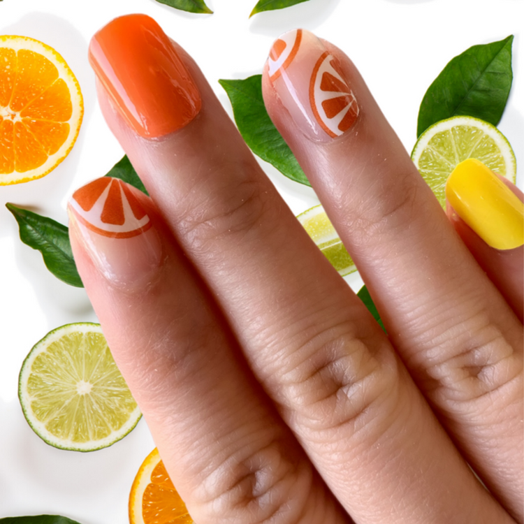Citrus Punch Cutie Pop Nail Shop nail strips with vibrant citrus-themed patterns on a white background.