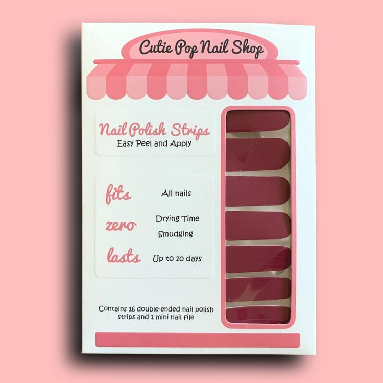 Magenta Magic nail strips by Cutie Pop Nail Shop showcasing vibrant magenta-colored nail art strips.