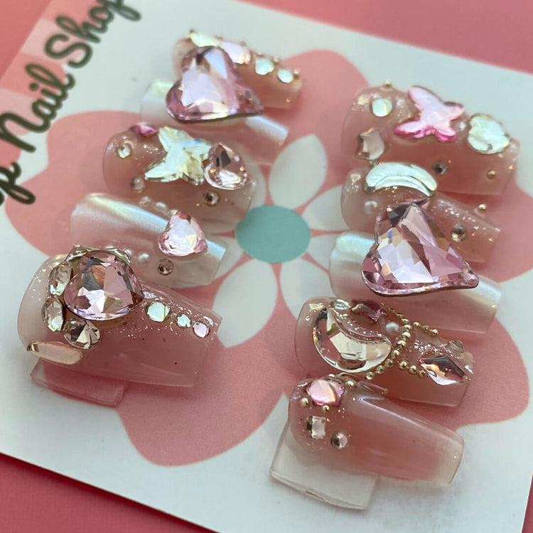 Short coffin press-on nails by Cutie Pop Nail Shop with magical rhinestone accents and a stylish, glossy finish.