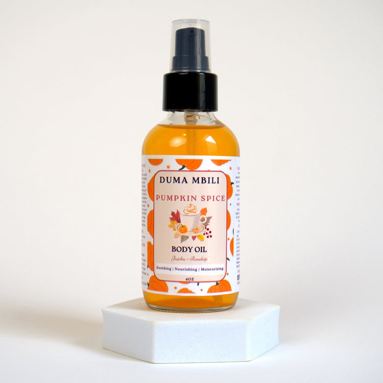 African Musk Body Oil by Duma Mbili LLC with pumpkin spice scent in a 4 oz pump bottle, showcasing a smooth, rich oil.