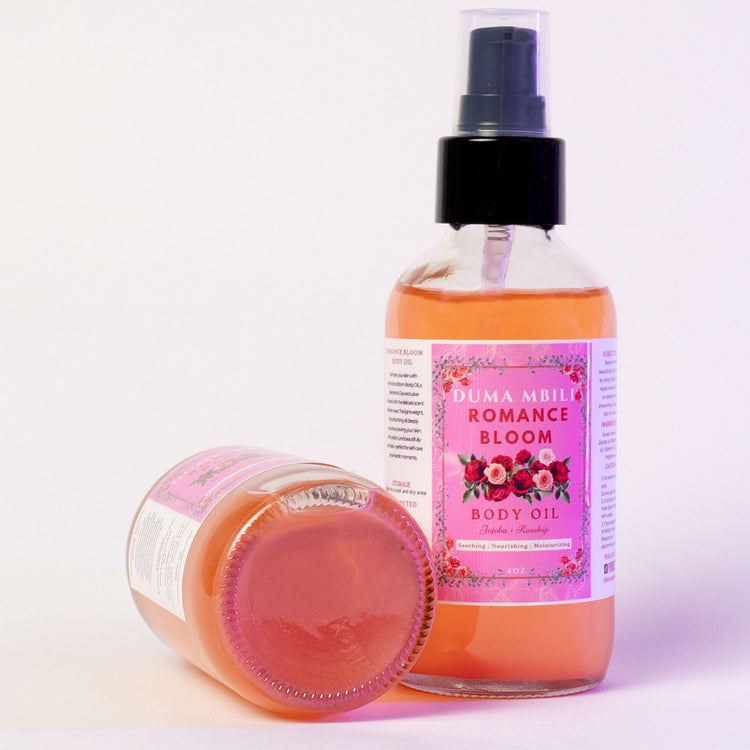 Duma Mbili LLC Romance Bloom African Musk Body Oil in a 4 oz bottle, with elegant packaging and golden oil inside.