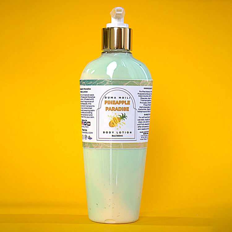 Duma Mbili LLC Pineapple Paradise Body Lotion bottle with tropical pineapple design and moisturizing label.