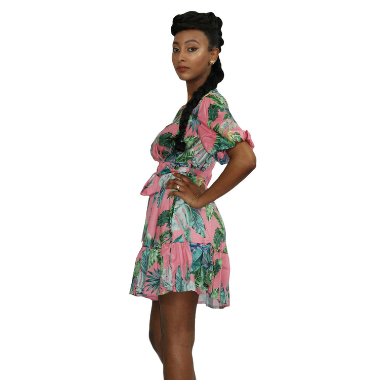 Floral V-neck summer mini dress by Duma Mbili LLC featuring a vibrant floral pattern and lightweight fabric.
