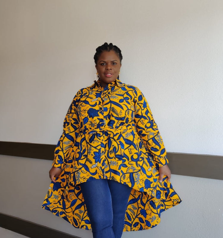 Blue and yellow Kente African print high-low button-up blouse by Duma Mbili LLC, featuring vibrant traditional fabric and stylish design.