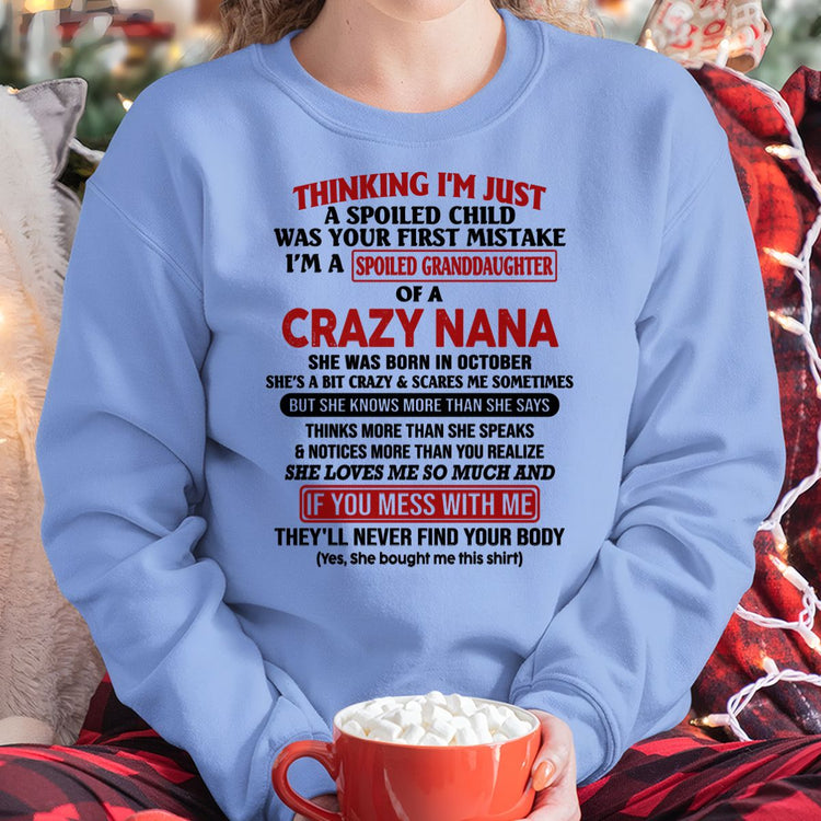 White TEELUVS.com T-shirt for granddaughter featuring "Spoiled Granddaughter of a Crazy Nana" October edition design.