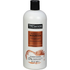 TRESemmé Botanique Nourish Conditioner with coconut milk and aloe, 28oz, in a white bottle with green accents.