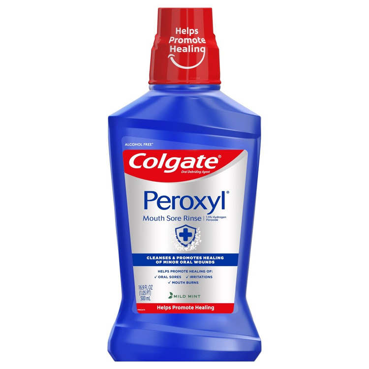 Colgate Peroxyl mouth sore rinse in 16.9 oz bottle, alcohol-free oral care product with cool mint flavor, designed for oral healing.