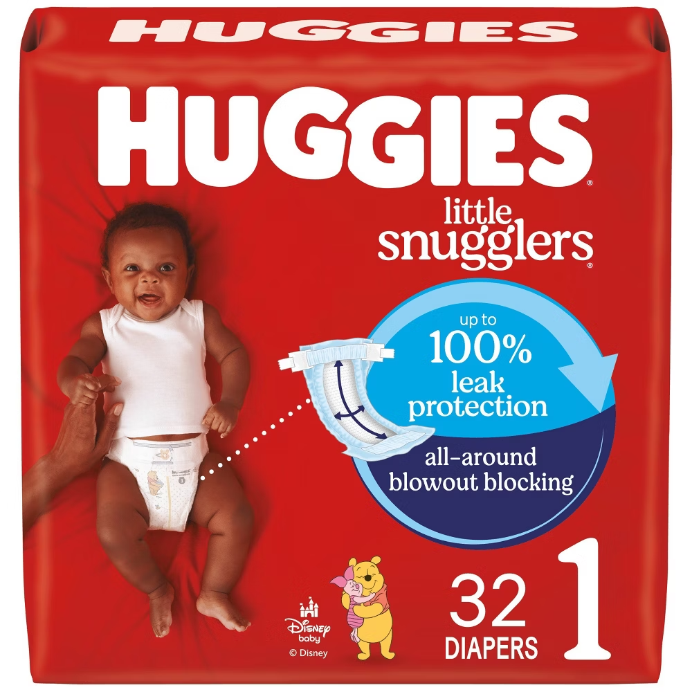 Huggies Little Snugglers size 1 diapers with 32 pieces, soft and absorbent for baby comfort, displayed in packaging.