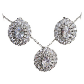 Elegant floral and gemstone jewelry set with matching necklace and earrings, featuring colorful floral designs and sparkling gemstones.