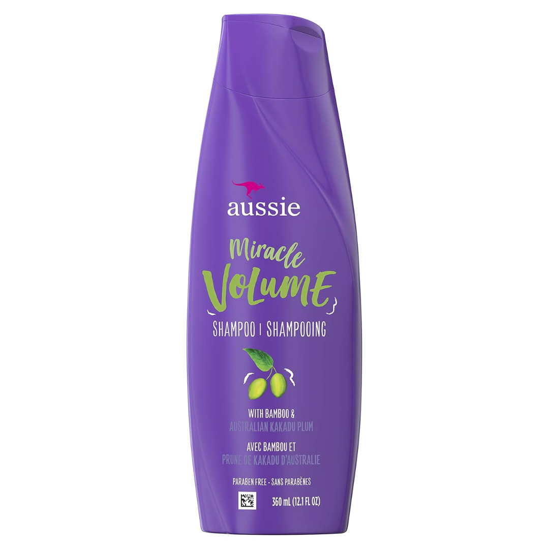 Aussie Miracle Volume Shampoo bottle, 12.1oz, with vibrant blue packaging and product label, designed for hair volume.