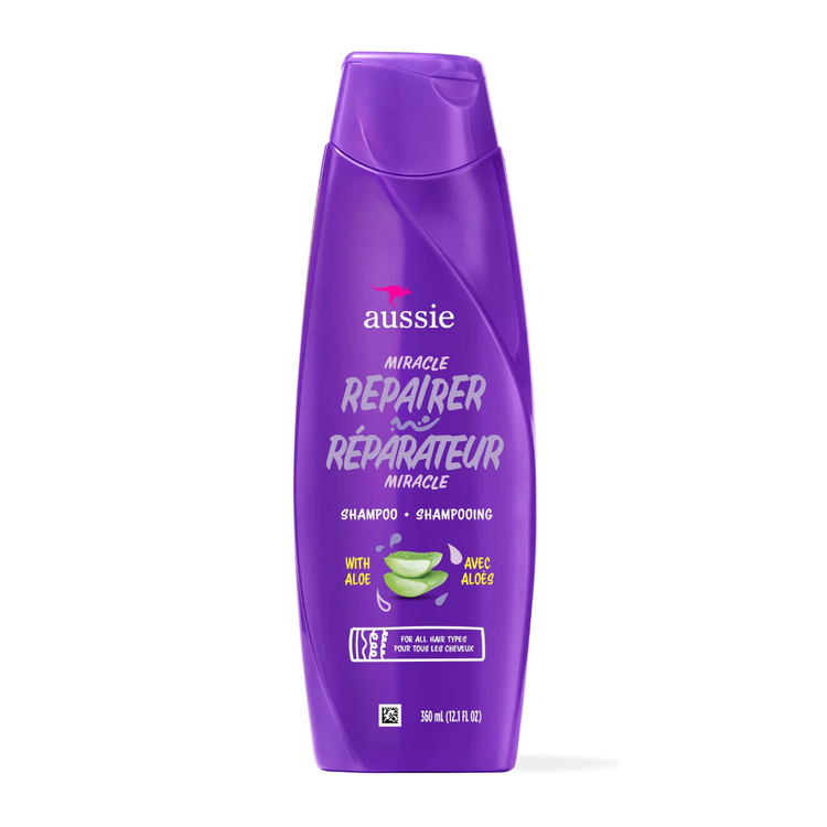 Aussie Miracle Repairer Shampoo with Aloe in a 12.1 oz bottle, designed for damaged hair repair and hydration.