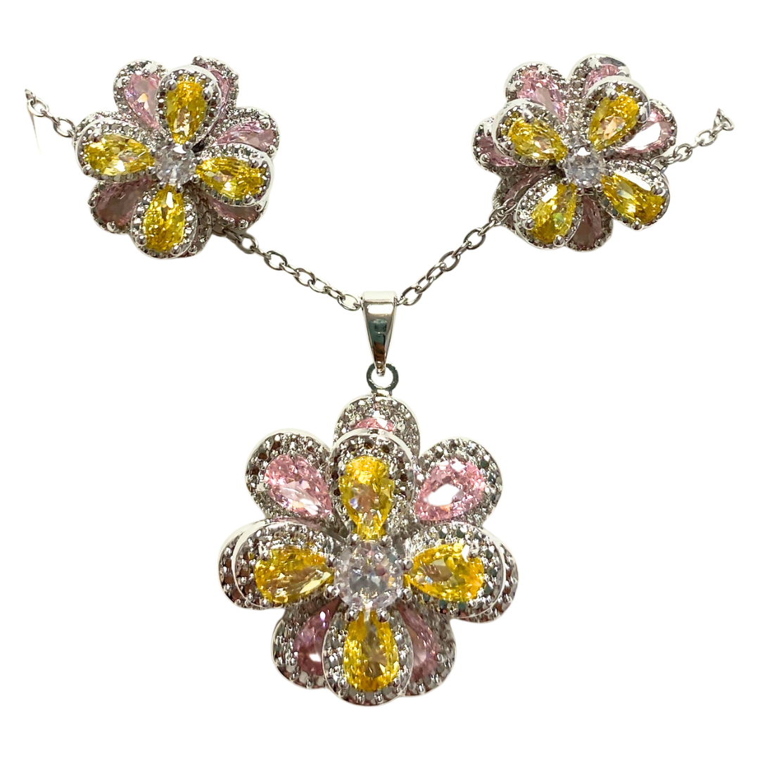 Elegant floral and gemstone necklace and earrings set from Farmacias Savia, showcasing colorful jewelry with intricate flower and gemstone details.