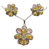 Elegant floral and gemstone necklace and earrings set from Farmacias Savia, showcasing colorful jewelry with intricate flower and gemstone details.