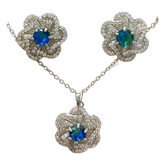 Floral and gemstone jewelry set with matching necklace and earrings, featuring colorful floral designs and sparkling gemstones.