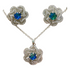 Floral and gemstone jewelry set with matching necklace and earrings, featuring colorful floral designs and sparkling gemstones.