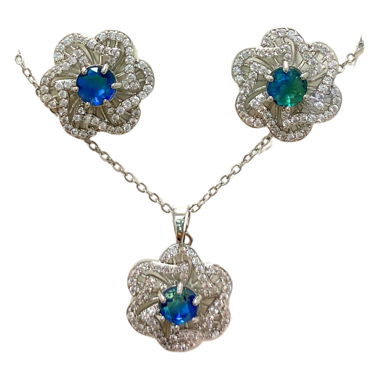 Floral and gemstone jewelry set with matching necklace and earrings, featuring colorful floral designs and sparkling gemstones.