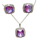 Elegant floral and gemstone jewelry set with matching necklace and earrings, featuring colorful floral designs and sparkling stones.