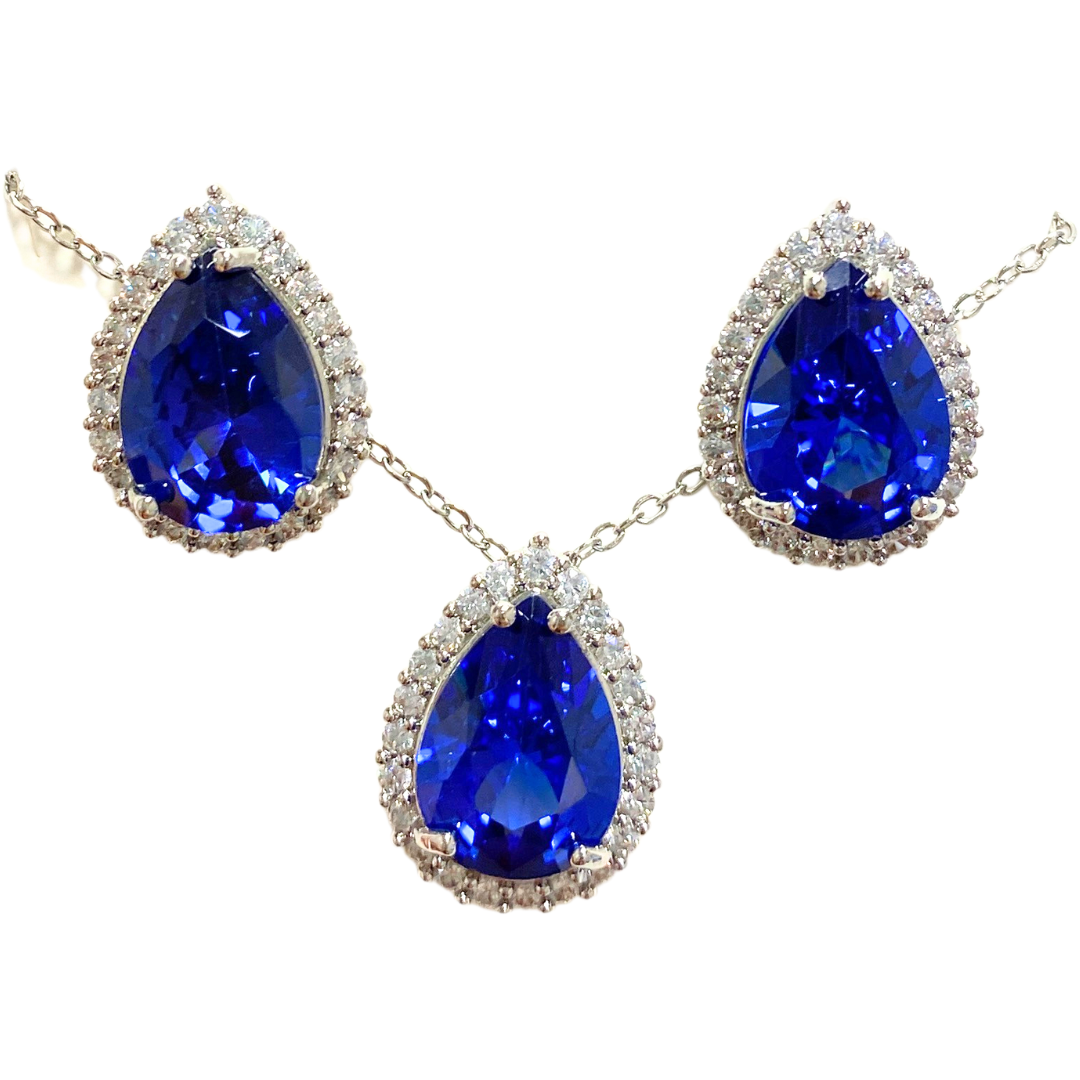 Elegant floral and gemstone jewelry set with matching necklace and earrings, featuring colorful floral designs and sparkling gemstones.