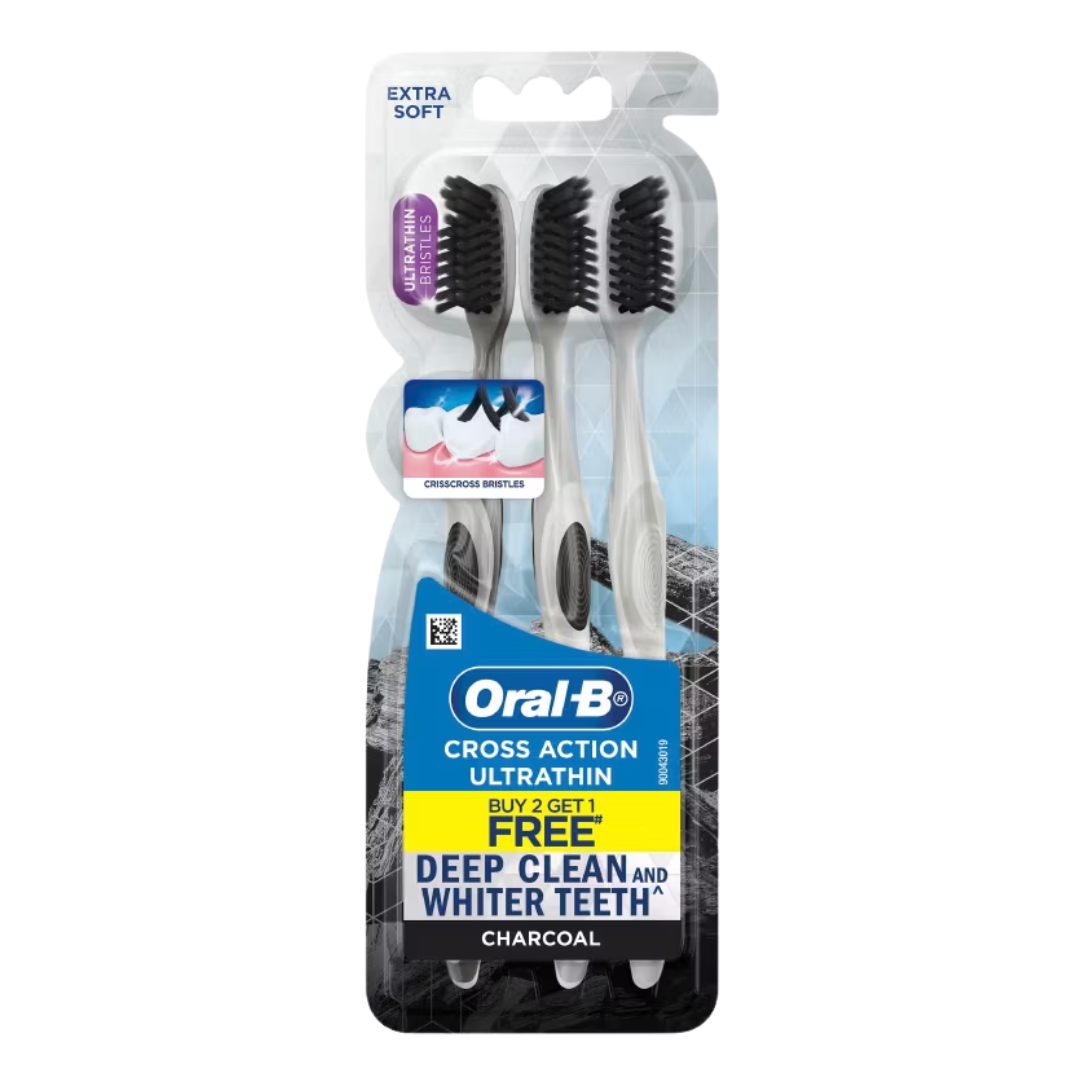 Oral-B extra soft charcoal toothbrushes in a 3-pack, featuring black bristles and ergonomic handles for gentle cleaning.