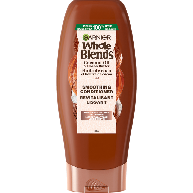 Garnier Whole Blends smoothing conditioner with coconut oil and cocoa butter in 12.5oz bottle, ideal for frizzy hair.