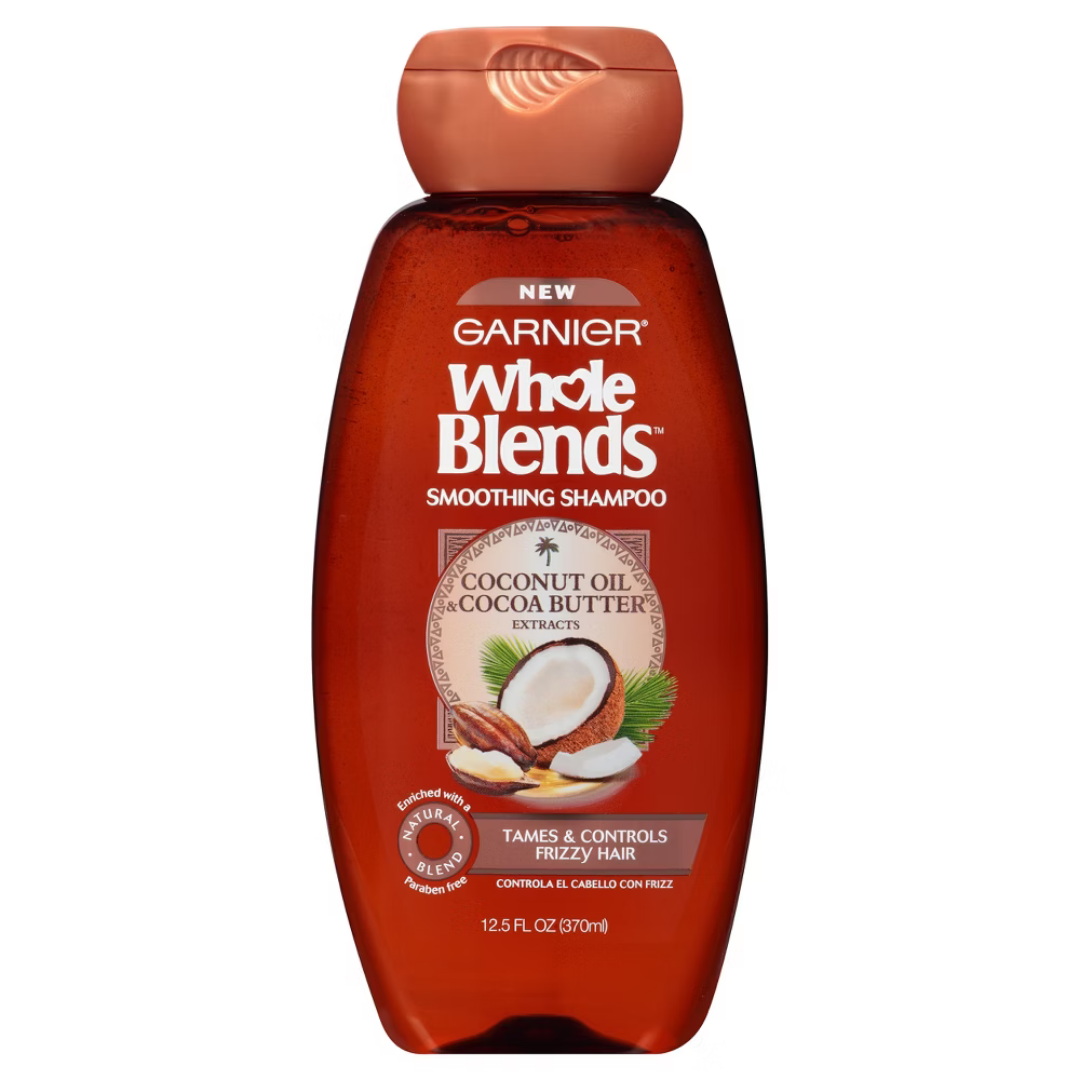 Garnier Whole Blends Smoothing Shampoo with coconut oil and cocoa butter, 12.5oz bottle, for smooth, nourished hair.