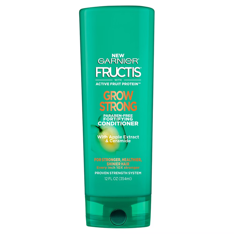 Garnier Fructis Grow Strong conditioner for hair in a 12 fl oz bottle, with green and white packaging and product label visible.
