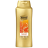 Suave Professionals Keratin Infusion Smoothing Conditioner in a 28oz bottle, designed to help smooth and strengthen hair.
