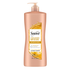 Suave Professionals Ceramide Infusion Age Brilliance Conditioner in a 28oz bottle with a white and purple label.