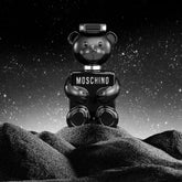 Moschino Toy Boy Eau de Parfum for Men, 3.4oz bottle with playful toy-inspired design, displayed in the image.