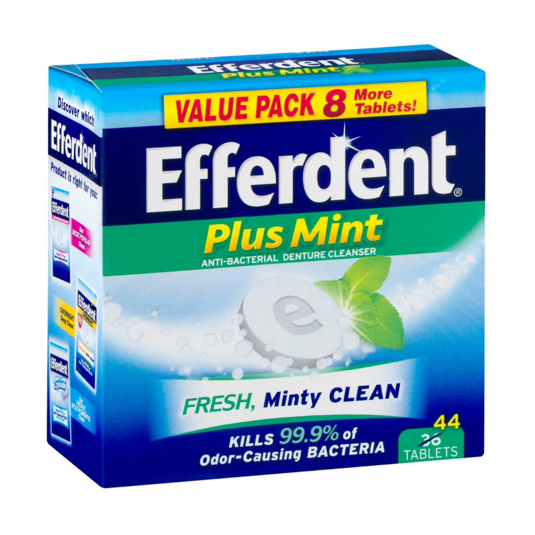 Efferdent Plus Mint Denture Cleanser Tablets 44 count in a clear plastic container with green and white labeling.