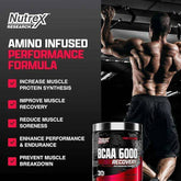 Bottle of Nutrex BCAA 6000 Recovery amino acids supplement with 30 servings, featuring a label with blue and white design.