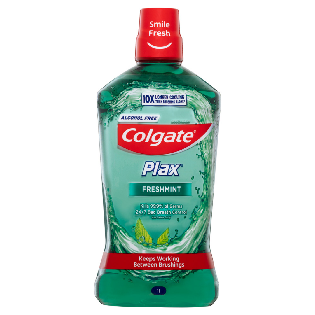 Colgate Plax Freshmint alcohol-free mouthwash in a 33.8 oz bottle, featuring a green label and mint flavor.