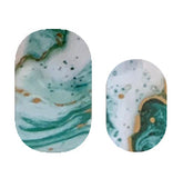 Justice Nail Strips by Cutie Pop Nail Shop, stylish and colorful nail strip design displayed on a surface.