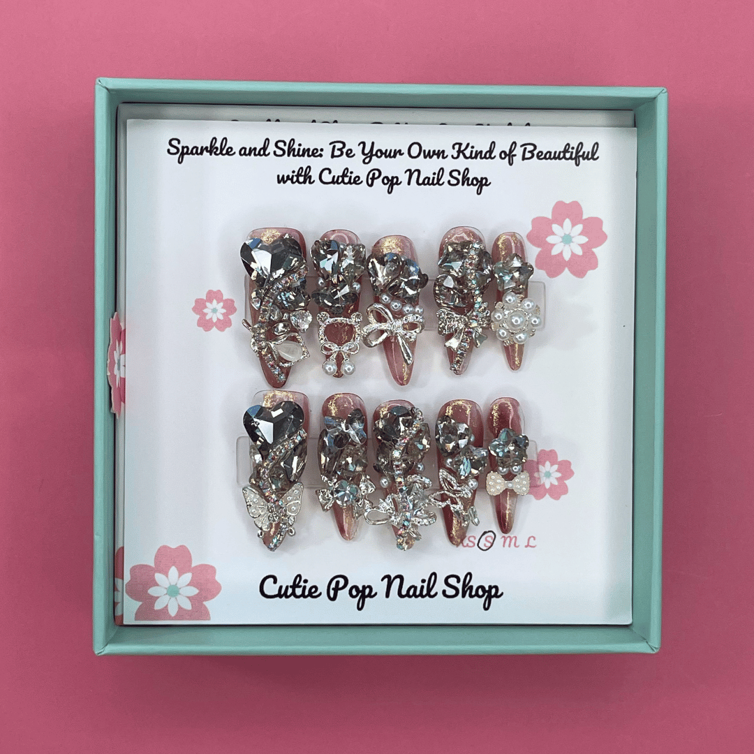 Press-on nails with sparkling rhinestone design, Bougie Bling 14 by Cutie Pop Nail Shop, showcasing glamorous nail art.