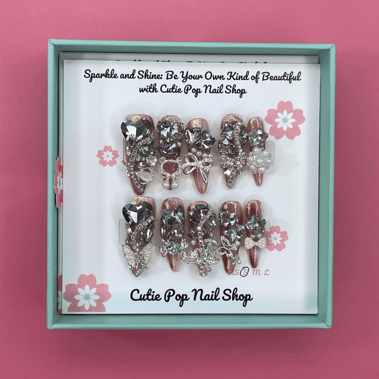 Press-on nails with sparkling rhinestone design, Bougie Bling 14 by Cutie Pop Nail Shop, showcasing glamorous nail art.