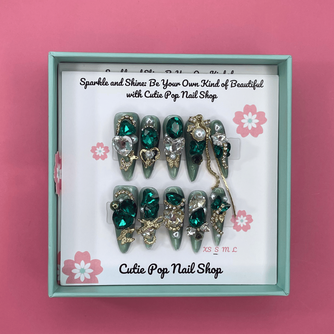 Press-on nails with shiny rhinestone accents from Cutie Pop Nail Shop&