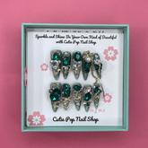 Press-on nails with shiny rhinestone accents from Cutie Pop Nail Shop&