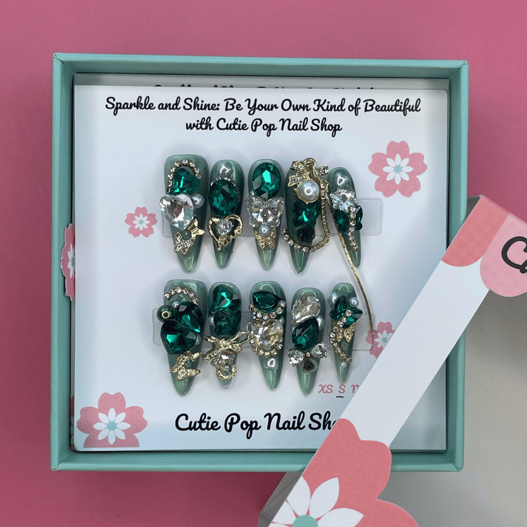 Press-on Bougie Bling 15 nails by Cutie Pop Nail Shop featuring shiny, glamorous nail designs with sparkling accents.